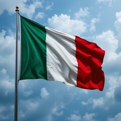 An Italian national flag on a pole with a cloudy sky background