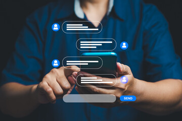close-up of hands texting on smartphone with holographic chat interface for social media and messagi
