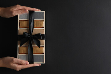 Poster - Chocolate bars in a gift box on a dark background