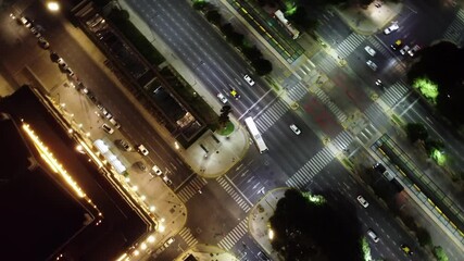 Wall Mural - Overhead View Of Cars Driving In The Road At Night In Buenos Aires, Argentina. - aerial shot
