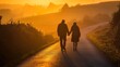 © Thanyaporn - Couple Walking Hand in Hand on a Scenic Path at Sunset