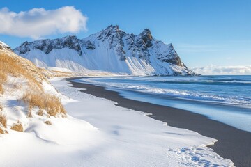 a snowy beach with a mountain in the background