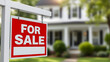 © Passionwith - Close-up of a real estate 'For Sale' sign with a blurred house in the background, showcasing modern home buying options.