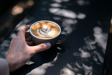 Wall Mural - a cup of latte with a heart on it