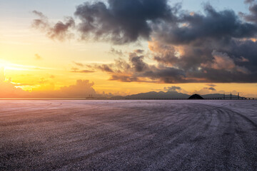 Wall Mural - asphalt road square and beautiful sky clouds at sunset. outdoor asphalt parking lot.