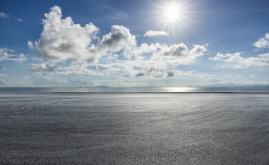 Wall Mural - Empty road and sky with ocean background