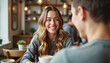 © LunaStar - Young woman smiling warmly in cozy cafe setting, joyful connection