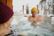 © Halfpoint - Senior couple bathing in hot tub during cold winter day. Romantic wellness getaway with spa during Valentine's weekend.
