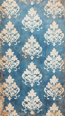 Wall Mural - The image depicts a blue fabric or paper with an intricate white damask pattern, featuring floral elements and curling vines