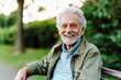© id512 - happy senior man smiling outdoors on a park bench,  active retirement, healthy lifestyle, and elderly happiness