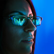 © master1305 - Side view of businesswoman wearing glasses reflecting colorful data and analytical graphics, showcasing technology, innovation, and professional focus. Concept of business, financial analytics