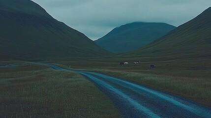 Wall Mural - Serene mountain road with grazing animals.