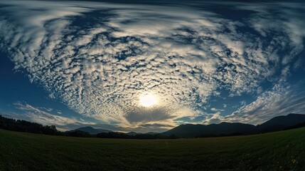 Wall Mural - A beautiful sunset scene with the sun setting behind a vast field of green grass