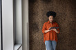 © ReeldealHD images - Young African American businesswoman standing and using a digital tablet in a modern office