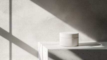 Leinwandbilder - Minimalist display of a white cosmetic jar on a light surface with soft shadows highlighting skincare product features
