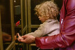 © Connect Images - Curly-haired child learning to press an elevator button with the help of an adult's guiding hand. Cleveland Public Library, Ohio, USA