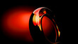 © Connect Images - Illustration, abstract red and black background with a glossy, swirling design evoking a sense of movement