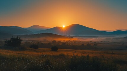 Wall Mural - A beautiful sunset over a valley in a mountainous area.