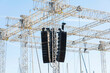 © Connect Images - Array of professional line array speakers suspended from a metal truss at an outdoor event, Marseille, France