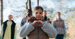 © ihorvsn - Little girl in middle making heart symbol with both hands in front of her chest.