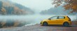 © svetlanais - A yellow hatchback car with foggy windows parked near a lake on a misty morning, capturing serenity