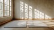 © musa - Sunlit room with two yoga mats.