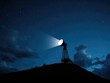 © LomaPari2021 - A massive searchlight perched atop a hill shines its light upwards into the starry night sky filled with clouds and constellations, celestial, hill