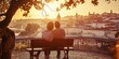 © Andrii Zastrozhnov - A couple is sitting on a bench overlooking a city. The sun is setting, casting a warm glow over the scene. The couple appears to be enjoying each other's company and the beautiful view