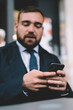 © BullRun - Blurred businessman using cellphone application for making online booking and banking,corporate director checking news of financial trade exchange on smartphone stock website connected to 4g on mobile