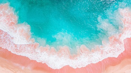 Aerial view of pink sand beach and turquoise ocean waves.