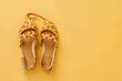 © Ilia - Giraffe print sandals on yellow background