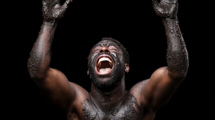 muddy man's cry: a dramatic, powerful image of a muscular man covered in mud, screaming with anguish