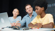 © InfiniteFlow - Caucasian teacher talking about electric tool while student fixing robotic model on table with electronic equipment placed. Diverse academic children learning about main board structure. Edification.