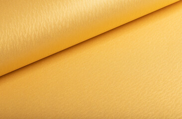Aufkleber - Golden yellow paper background with rippled, wavy metallic textures and a rolled, smooth surface. Warm vibrant tones and a polished design create a refined, luxurious, and dynamic composition.