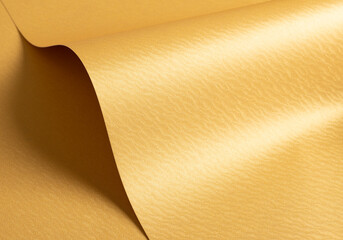 Aufkleber - Golden yellow paper background with rippled, wavy metallic textures and curved, smooth surfaces. Vibrant warm tones and a flowing, polished design create a refined, luxurious, and dynamic composition.
