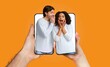 © Prostock-studio - A man and woman share an excited conversation while holding a smartphone. Their expressions show joy and surprise as they connect through technology. This captures modern relationship dynamics.
