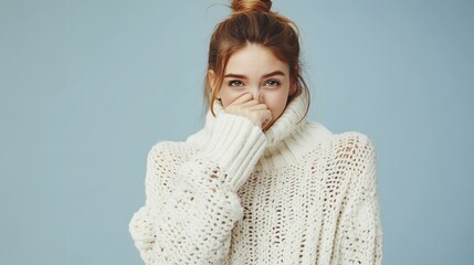 Wall Mural - Woman in White Knit Sweater Covering Nose