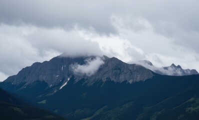 Wall Mural - Majestic mountain shrouded in clouds