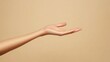 © Kenny - Female hand reaching out on beige background