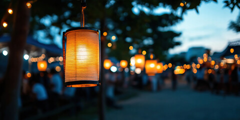 Wall Mural - Illuminated Paper Lantern at Dusk with Blurred Background