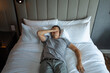 © kieferpix - Stressed exhausted young man lying in bed