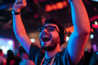© Muzamil - Excited gamer celebrating victory during a competition in a vibrant esports arena