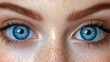 © JO BLA CO - A woman with blue eyes and brown hair. The eyes are open and staring. The woman has a light skin tone and a freckled face