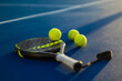 © Mike Orlov - Padel tennis racket. Background with copy space. Sport court and ball