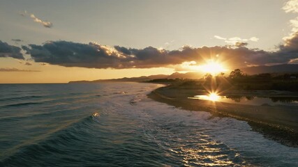 Wall Mural - Religious Ocean At Sunset With Low Sun Silhouette Of Mountains