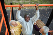 © Marko Geber - Senior men working out at outdoor park gym