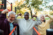 © Marko Geber - Senior men flexing muscles at outdoor park gym