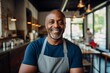 © Baba Images - Smiling portrait of a middle aged male African American small business owner