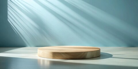 Poster - Circular wooden platform in sunlit room against pale blue wall