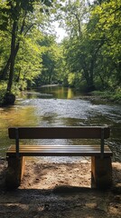 Wall Mural - A peaceful riverside bench with a view of gently flowing water, surrounded by trees and a soft breeze.